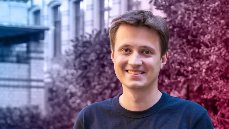 Portrait of Dmitrii Pavlov in front of a bush at the institute.