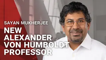 Portrait of Sayan Mukherjee next to the words "New Alexander von Humboldt Professor"
