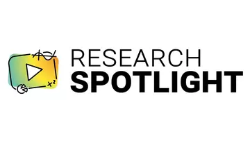 Stylized play button next to the words Research Spotlight
