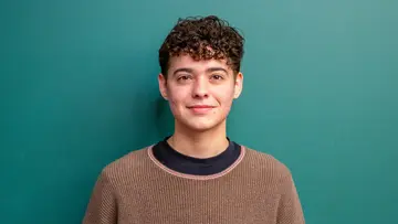 Portrait of Skye Rothstein in front of a green background