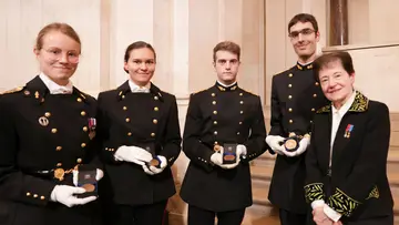 Five people in uniform with the Louis-Édouard Rivot medal