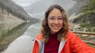 Portrait of Dani Kaufman in front of mountains