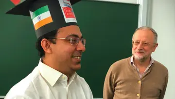 Pradeep Banerjee with his doctoral hat next to Jürgen Jost