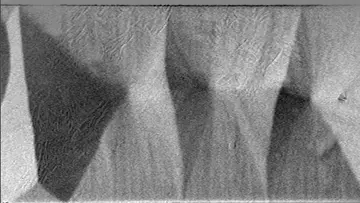 Figure: A permalloy thin-film exhibiting a cross-tie wall pattern and the magnetization ripple