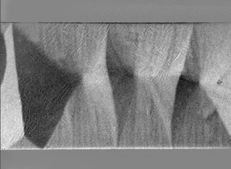 Figure: A permalloy thin-film exhibiting a cross-tie wall pattern and the magnetization ripple