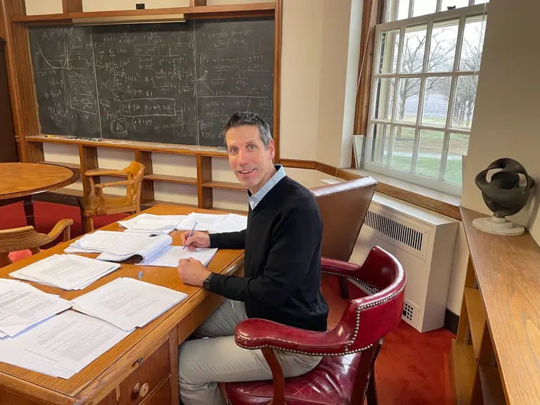 László Székelyhidi sitting at the desk